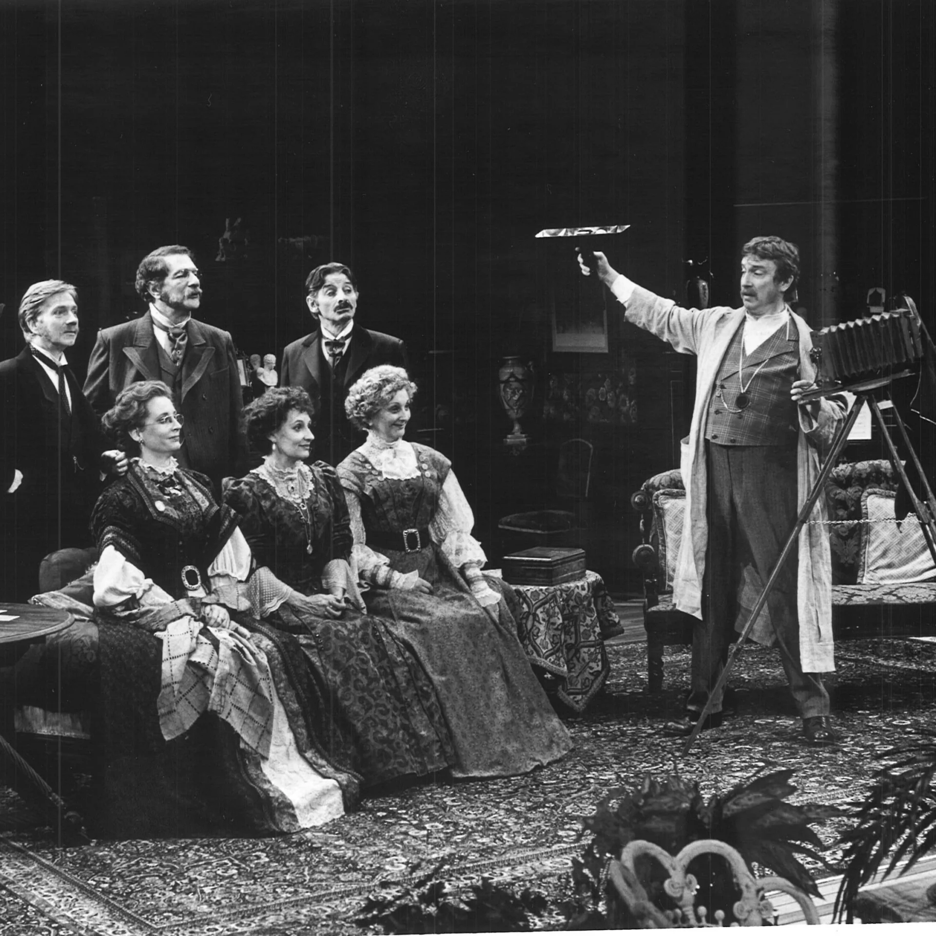 A group is gathered together and are getting their picture taken.