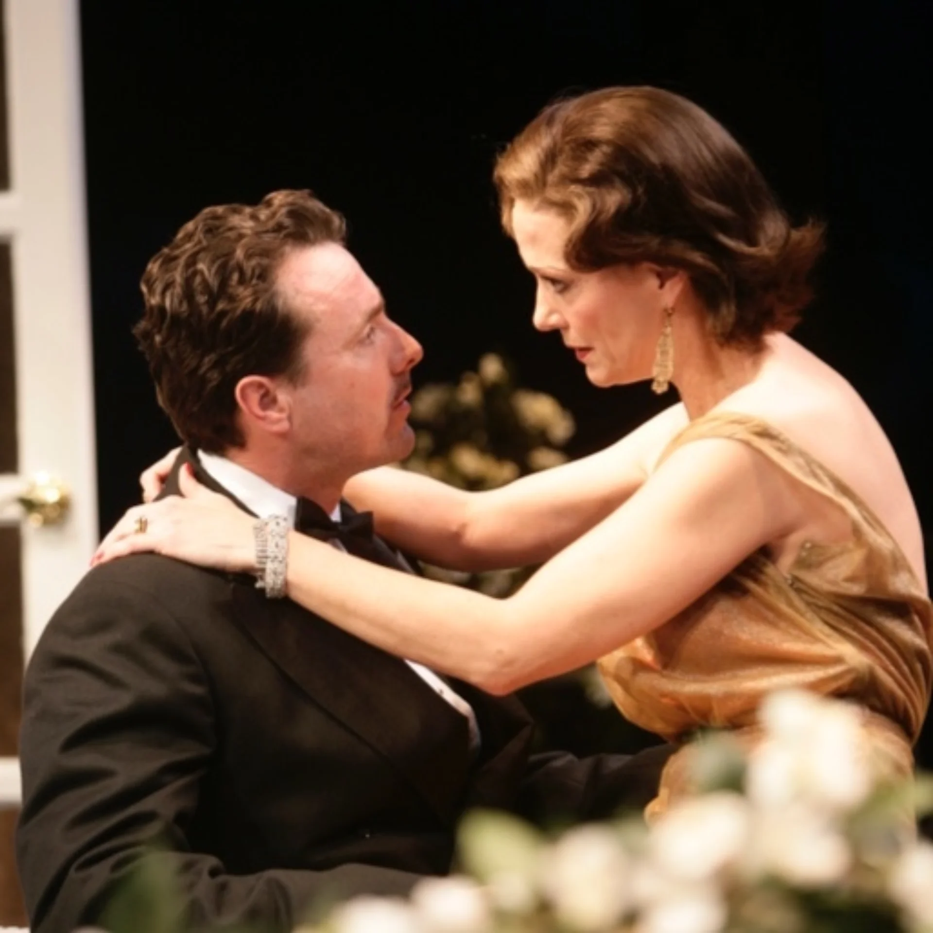 A man and woman hold each other