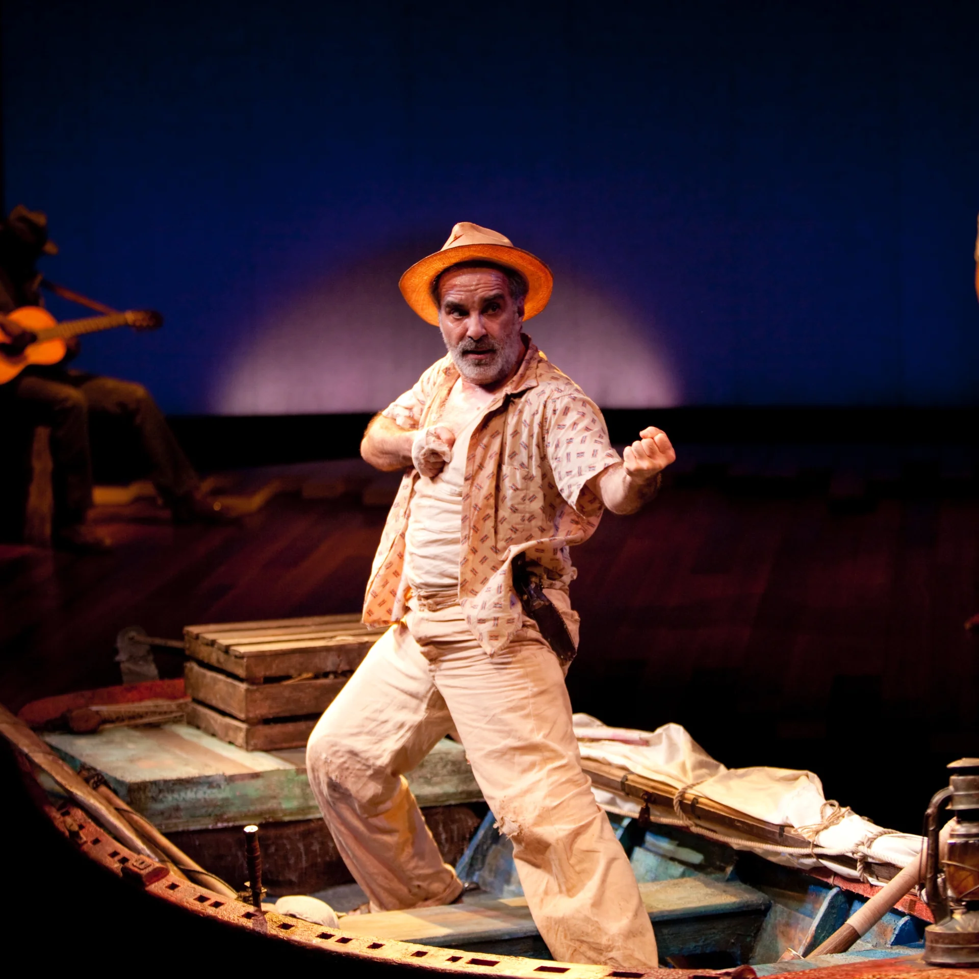 A man stands in a rowboat