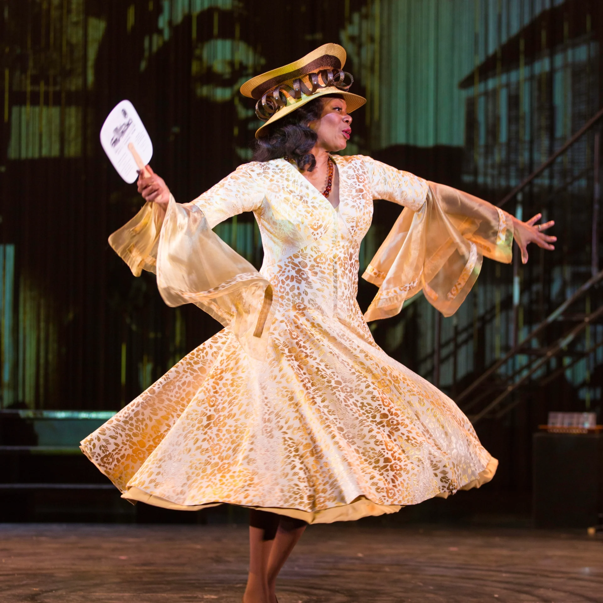 A woman in a white dress walks elegantly